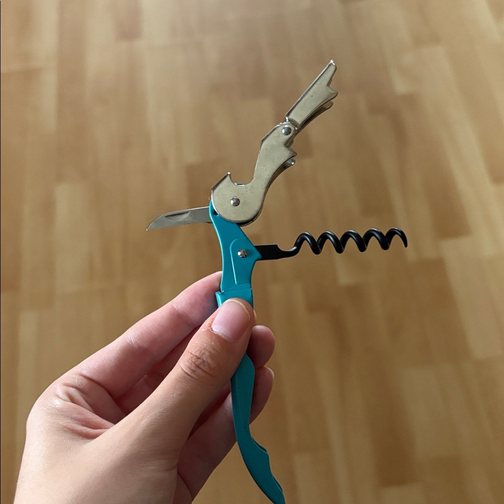PRICED TO SELL Corkscrew and bottle opener tool in blue and silver